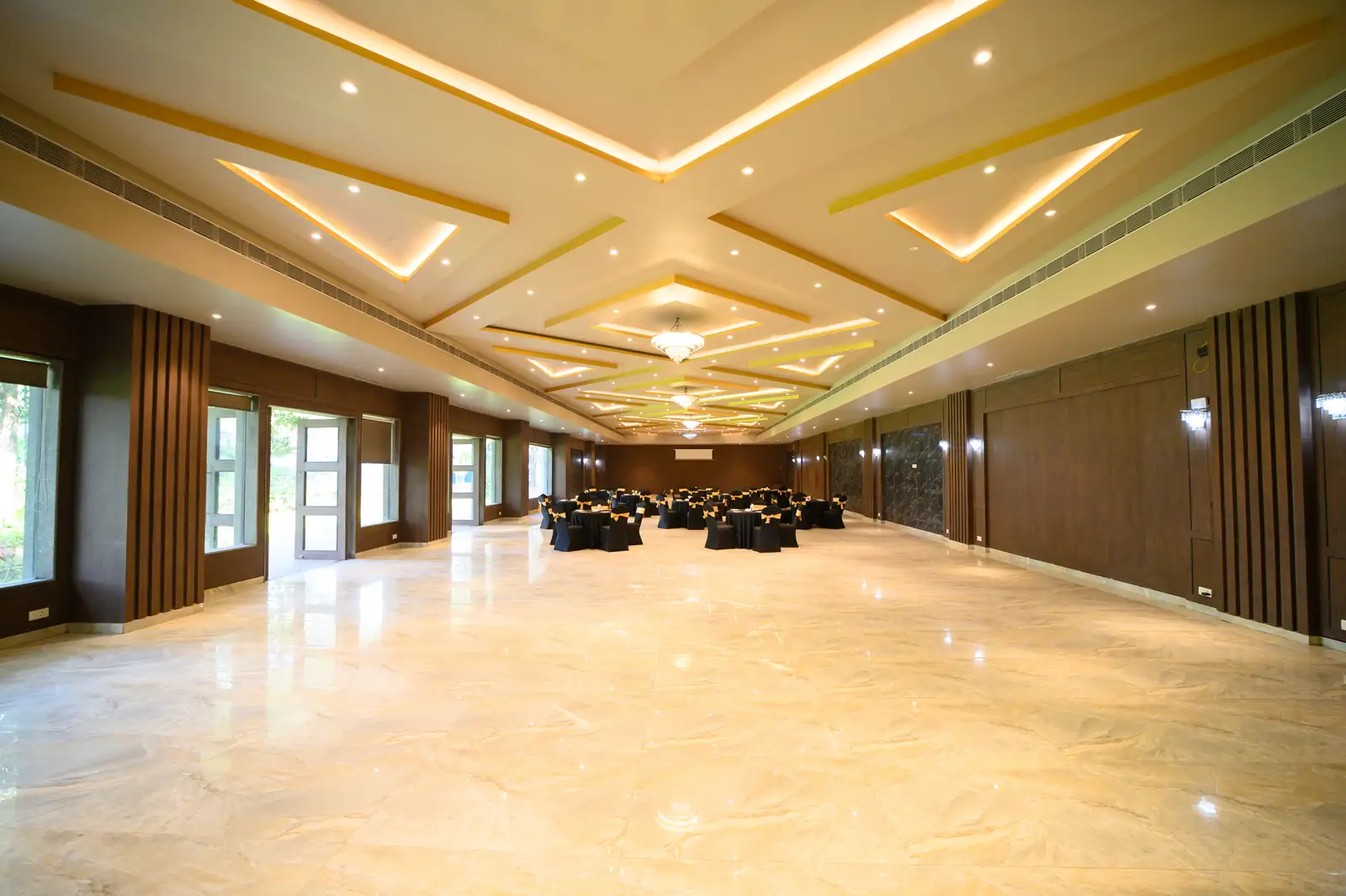 The Iris Hall dressed in banquet style, opening onto the gardens