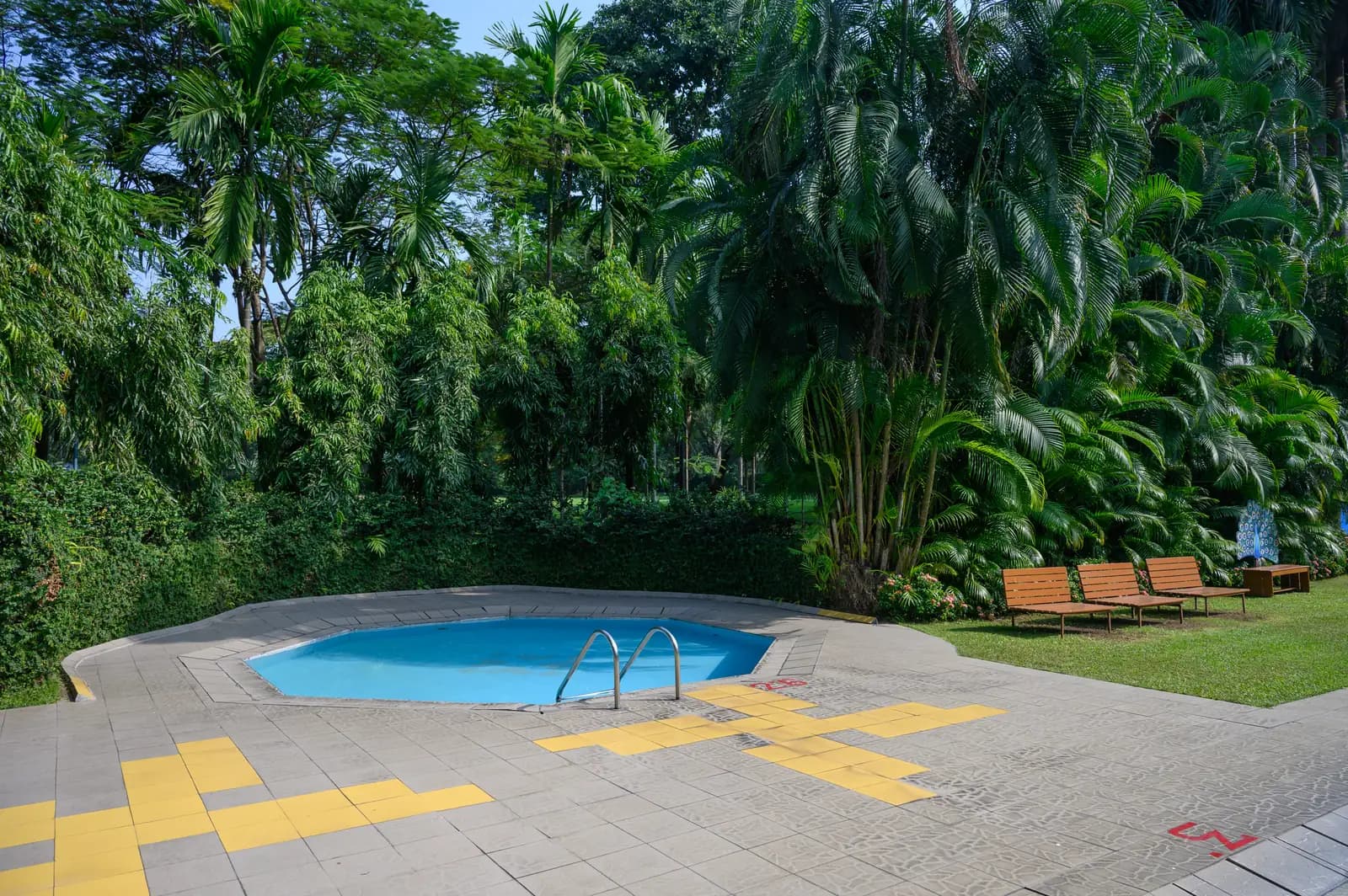 The pool and sundeck by day, with a dedicated children's wading pool
