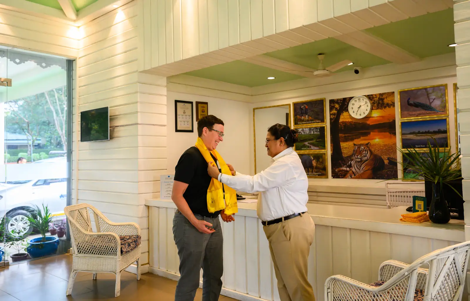 A guest welcomed at reception with the traditional khada scarf