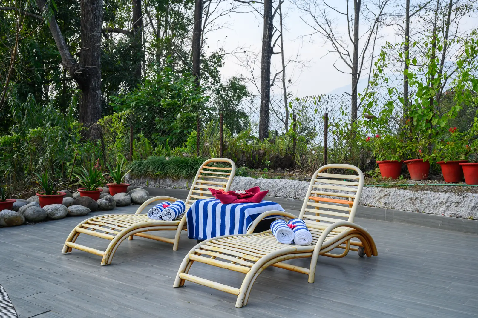 Poolside loungers at Sinclairs Retreat Kalimpong