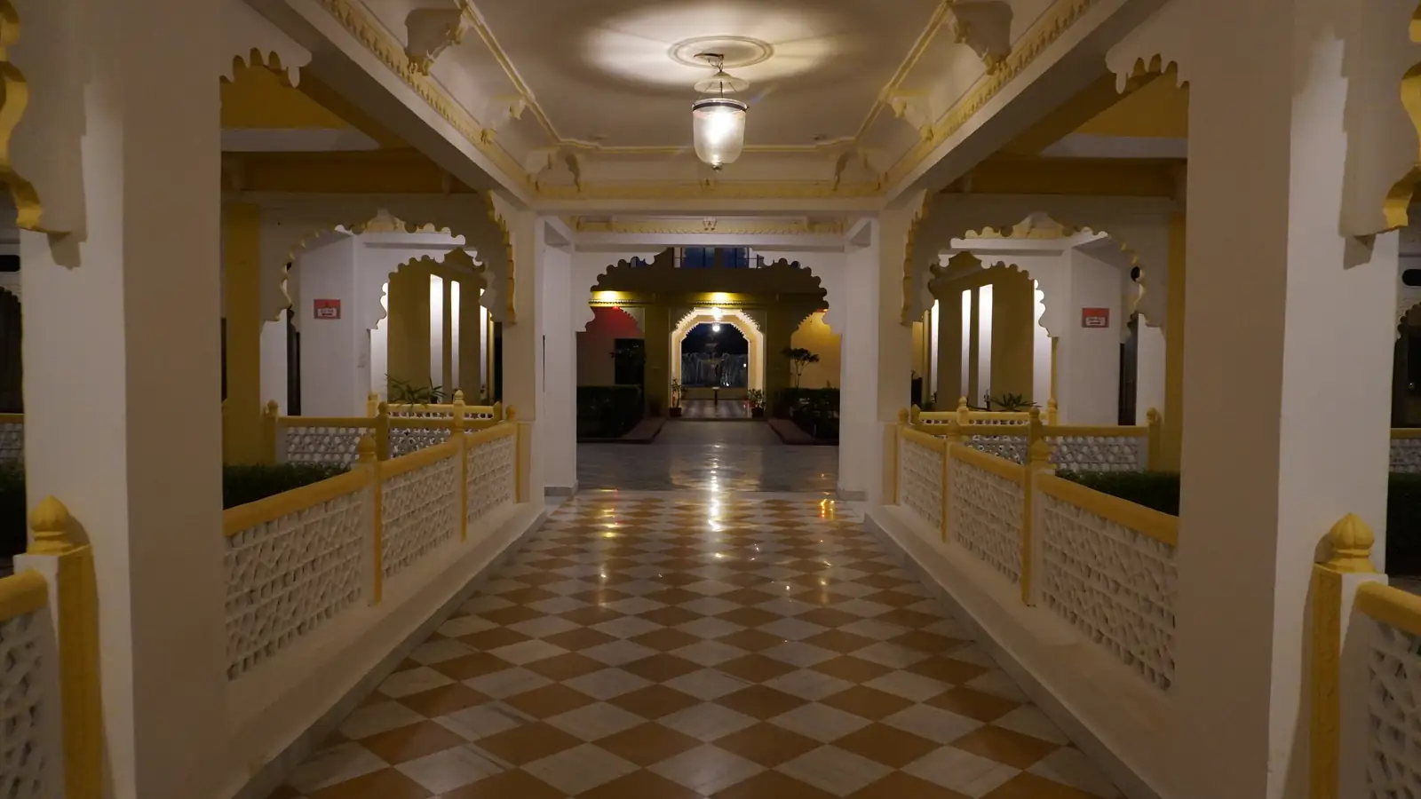 The palace corridor lit up at night